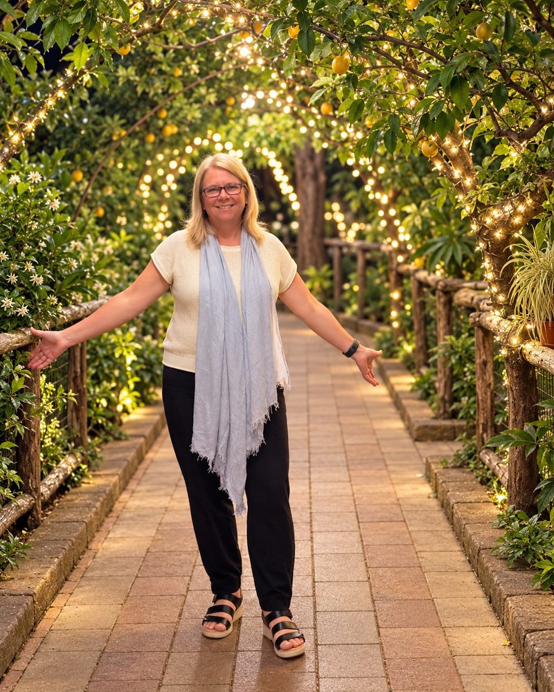 Andrea, The Plant Lady, in a garden path